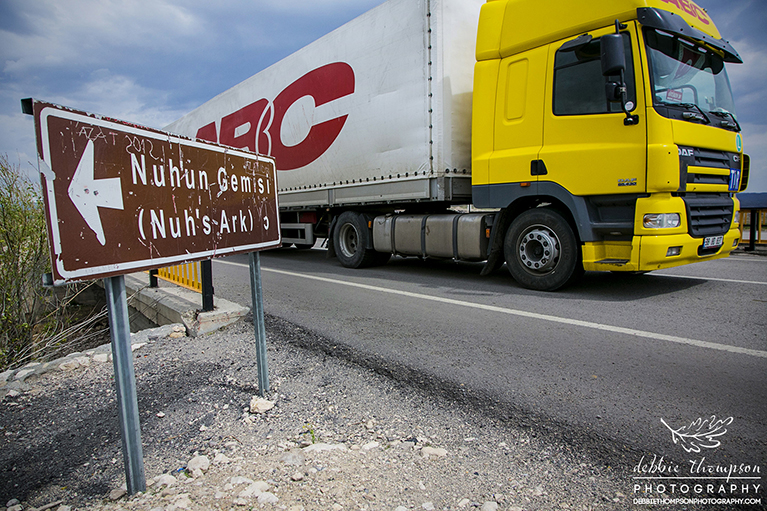 An Iranian truck passing the sign for Noah's Ark